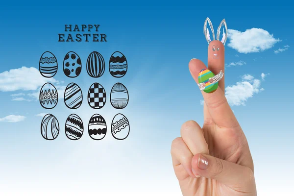 Fingers as easter bunny against blue sky — Stock Photo, Image