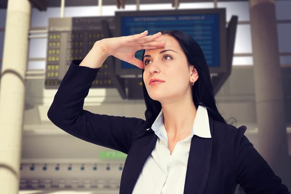 Mujer de negocios mirando con la mano arriba — Foto de Stock