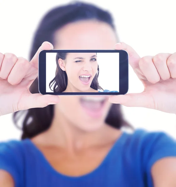 Pretty brunette winking at camera — Stock Photo, Image