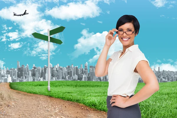 Composite image of thoughtful businesswoman — Stock Photo, Image