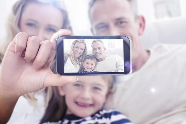 Composite image of hand holding smartphone showing — Stock Photo, Image