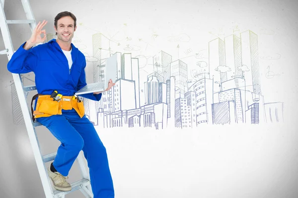 Confident repairman holding laptop — Stock Photo, Image