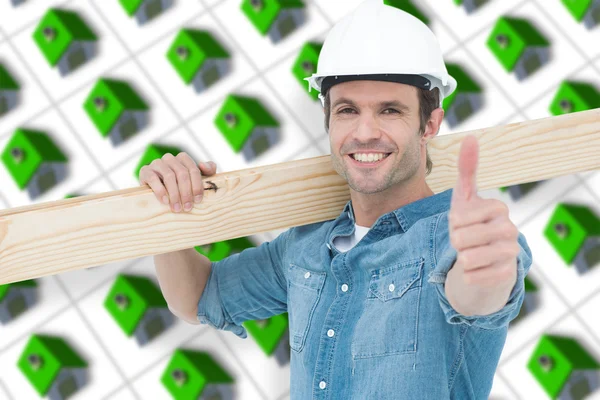Confident carpenter carrying wooden plank — Stock Photo, Image