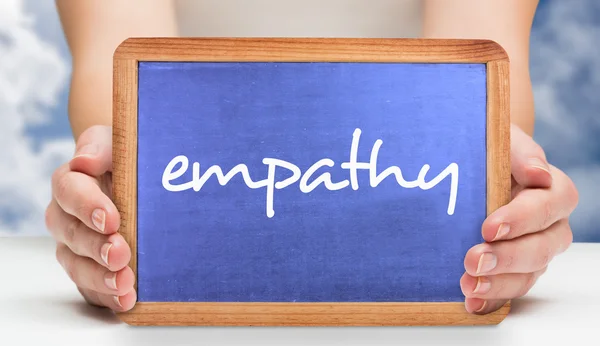 Empathy and hands showing chalkboard — Stock Photo, Image