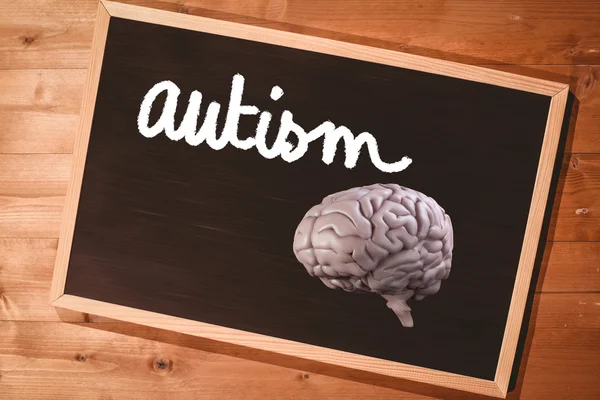 Hjärnan mot tavlan med inskriptionen autism — Stockfoto