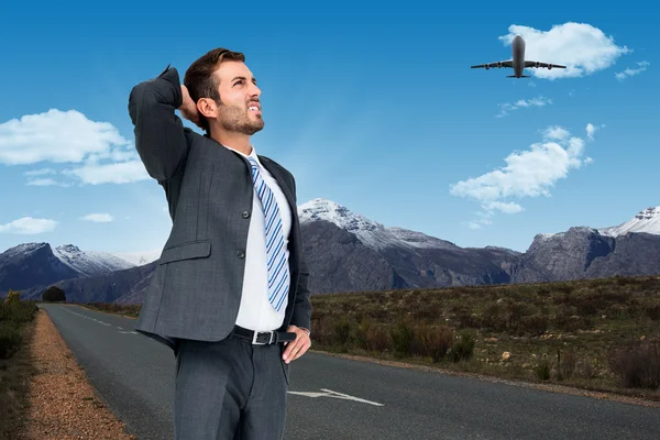 Imagen compuesta del hombre de negocios pensante — Foto de Stock