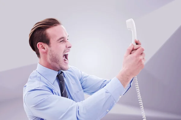 Businessman shouting at phone — Stock Photo, Image