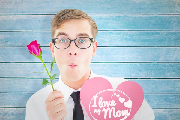 Geeky hipster holding a red rose — Stock Photo, Image