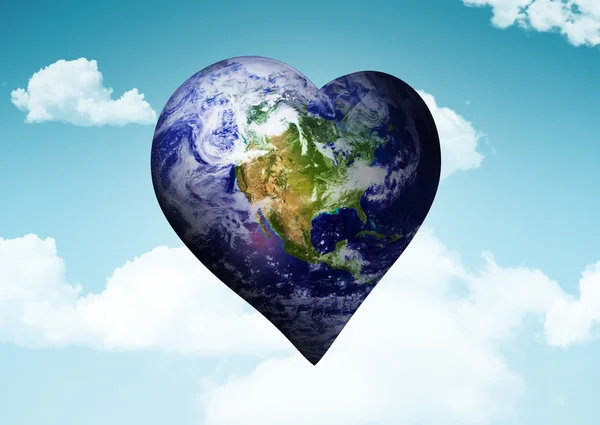 Composite image of heart shaped earth — Stock Photo, Image