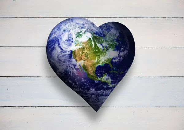 Composite image of heart shaped earth — Stock Photo, Image