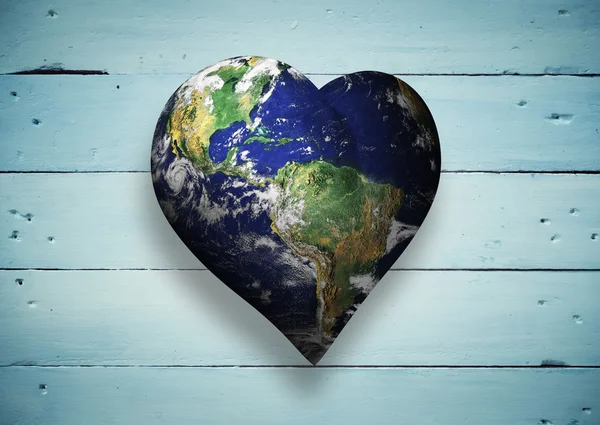 Composite image of heart shaped earth — Stock Photo, Image