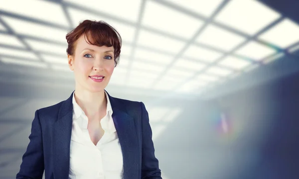 Composite image of smiling businesswoman — Stock Photo, Image