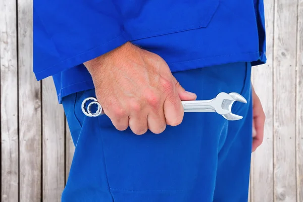 Mechanic holding spanners — Stock Photo, Image