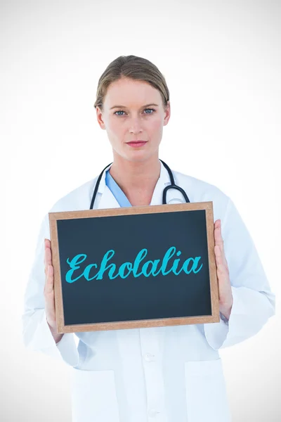 Echolalia against doctor showing chalkboard — Stock Photo, Image