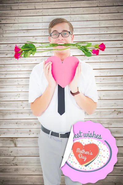 Hipster holding red roses and heart card — Stock Photo, Image