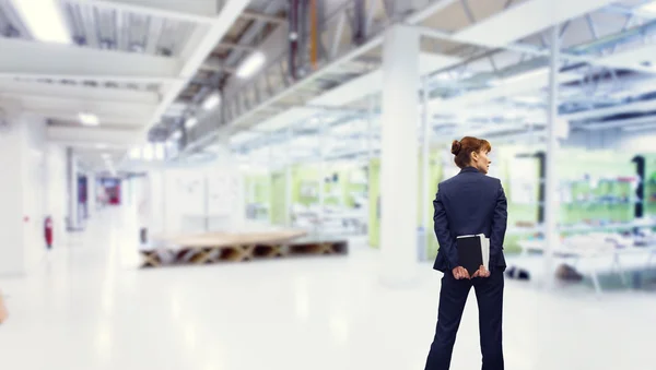 Composite image of businesswoman holding diary — Stock Photo, Image