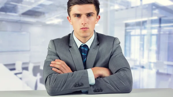 Composite image of serious businessman — Stock Photo, Image