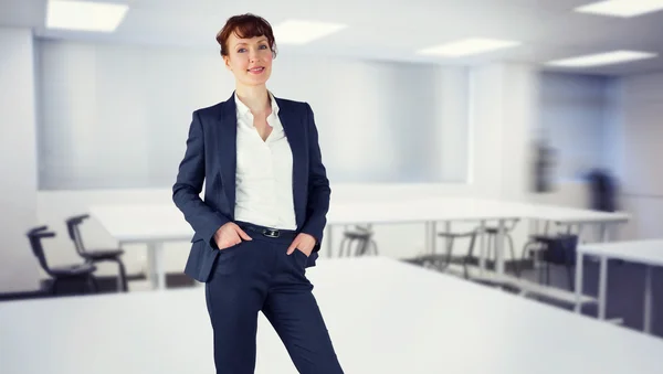 Composite image of smiling businesswoman — Stock Photo, Image