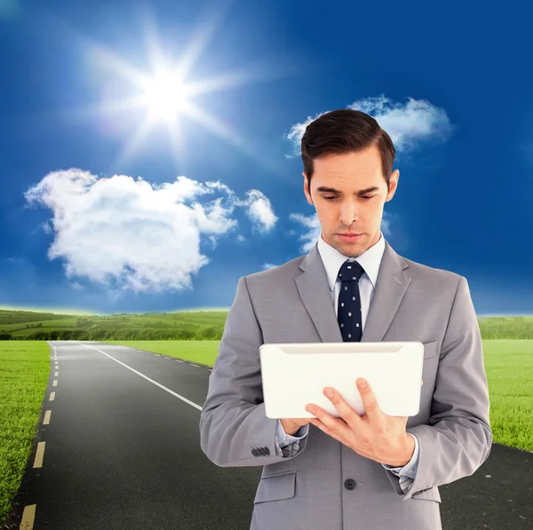 Businessman holding a tablet computer — Stock Photo, Image