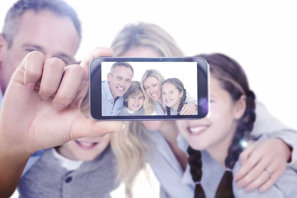 Composite image of hand holding smartphone showing — Stock Photo, Image