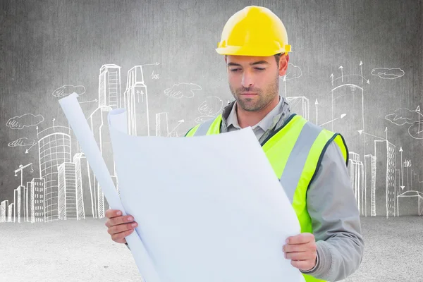 Casual architect against city plan — Stock Photo, Image