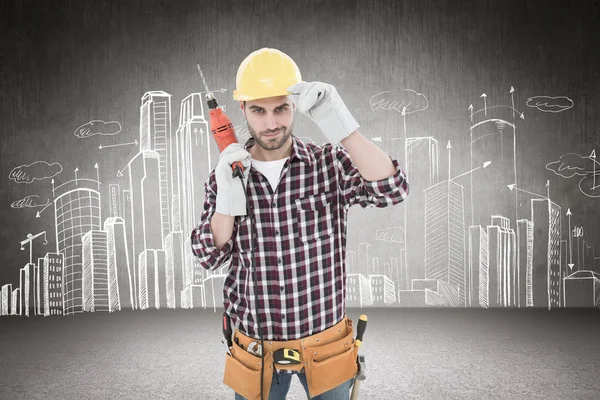 Confident handyman holding drill machine — Stock Photo, Image