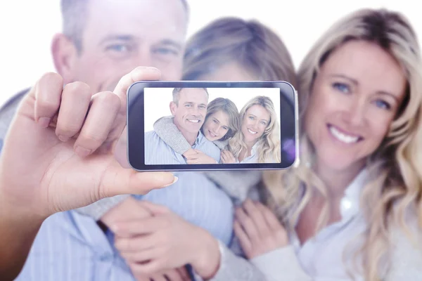 Composite image of hand holding smartphone showing — Stock Photo, Image