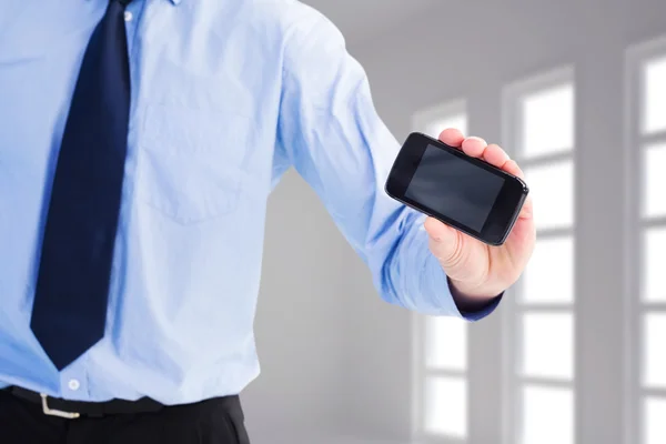 Businessman holding a phone — Stock Photo, Image