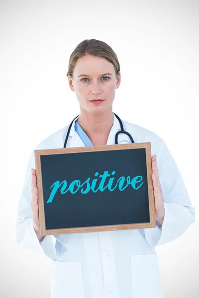 Positive against doctor showing chalkboard — Stock Photo, Image