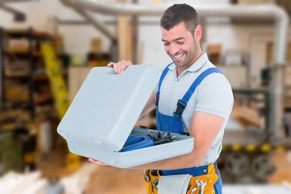 Happy repairman opening toolbox — Stock Photo, Image