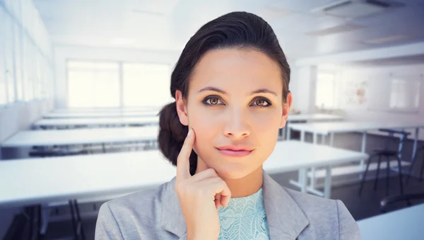 Composite image of happy brunette — Stock Photo, Image