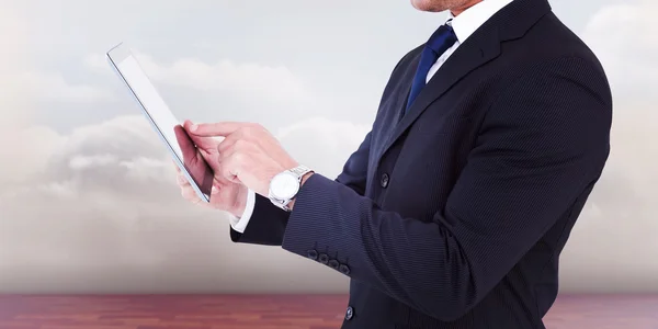 Businessman in suit using digital tablet — Stock Photo, Image