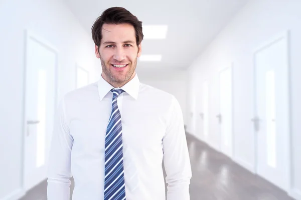 Businessman standing with hands in pockets — Stock Photo, Image