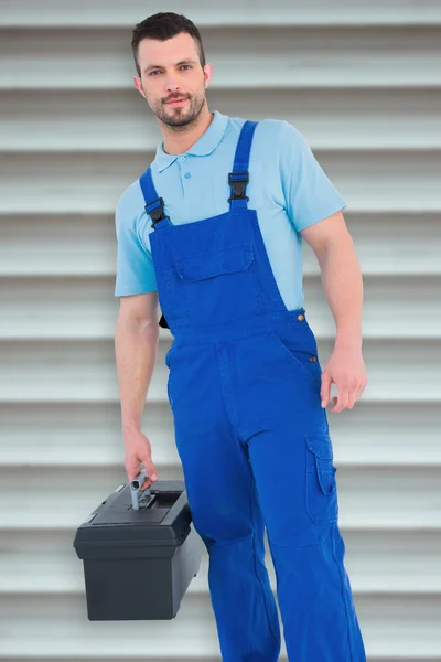 Repairman carrying toolbox — Stock Photo, Image