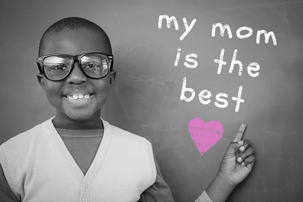 Composite image of schoolchild with blackboard — Stock Photo, Image