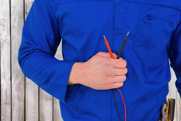 Electrician holding multimeter — Stock Photo, Image