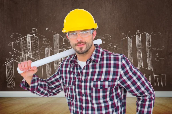 Handyman håller uppkavlade blueprint — Stockfoto