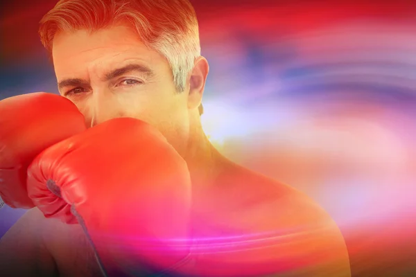 Man punching with boxing gloves — Stock Photo, Image