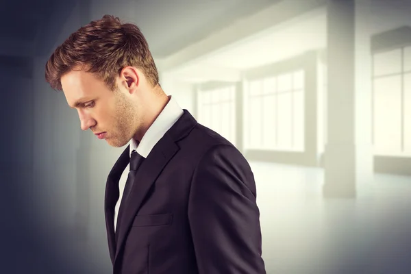 Young handsome businessman looking down — Stock Photo, Image