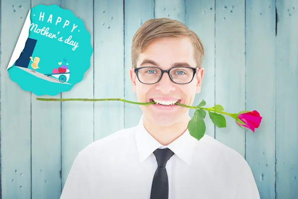 Hipster holding a red rose in his teeth — Stock Photo, Image