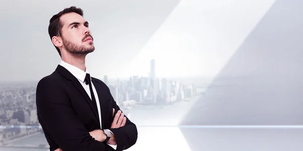 Thinking businessman with his arms crossed — Stock Photo, Image