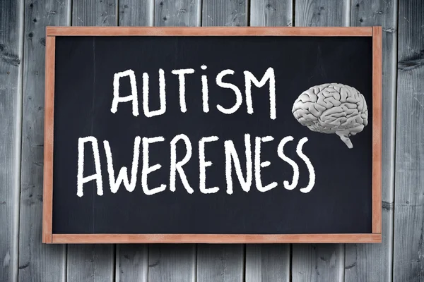 Mozek proti tabulí s nápisem autismu — Stock fotografie