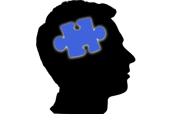 Jigsaw piece against silhouette of head — Stock Photo, Image