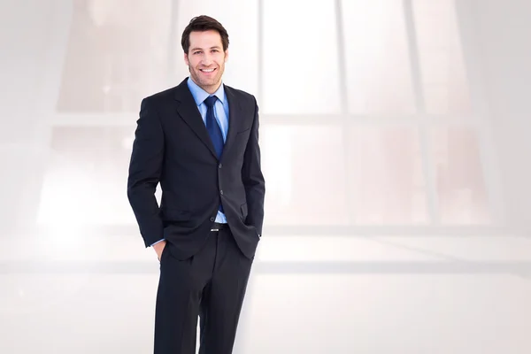 Businessman with hands in pockets — Stock Photo, Image