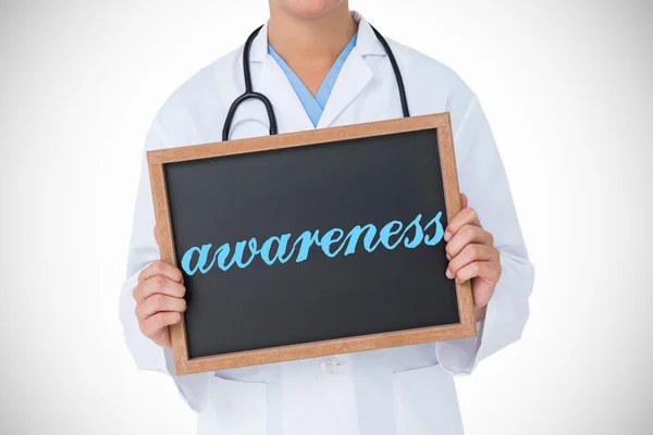 Awareness against doctor showing blackboard — Stock Photo, Image
