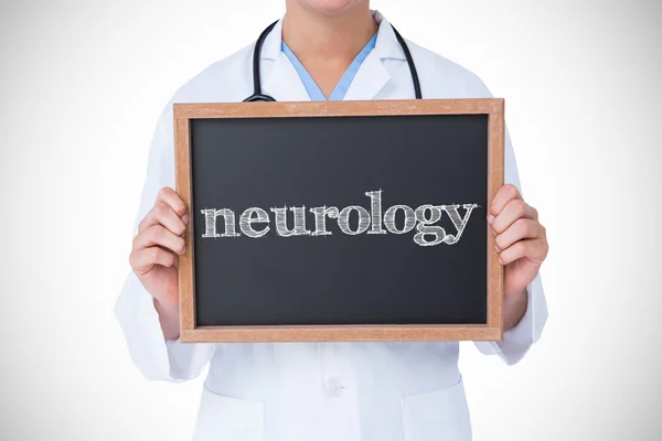 Neurology against doctor showing little blackboard — Stock Photo, Image