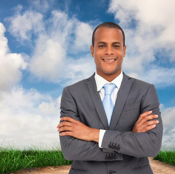 Charismatic young businessman with arms crossed — Stock Photo, Image