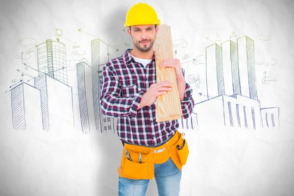 Handyman holding wood planks — Stock Photo, Image