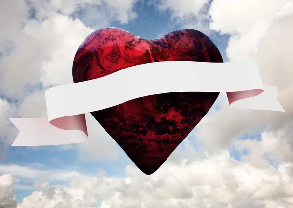 Samengestelde afbeelding van rode aarde hart met scroll — Stockfoto