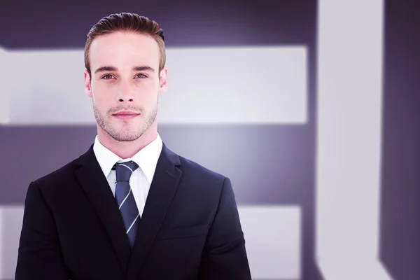 Frowning businessman looking at camera — Stock Photo, Image